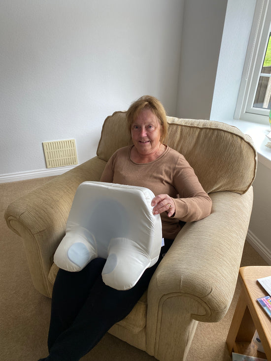 Middle aged lady with silk posture correction anti-wrinkle pillow